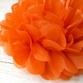 orange tissue pom poms, paper ball party decorations